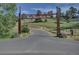 Inviting entrance to Mount Vernon Country Club with well-manicured landscaping at 513 Mt Blue Sky Rd, Golden, CO 80401