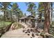Charming home with wood plank exterior and an inviting front entrance at 513 Mt Blue Sky Rd, Golden, CO 80401