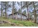 This exterior elevation shows a two-story home with a stone foundation and a partially-covered walkout basement at 513 Mt Blue Sky Rd, Golden, CO 80401