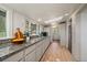 Kitchen featuring granite counters, stainless steel appliances, and a view of the outdoor scenery at 513 Mt Blue Sky Rd, Golden, CO 80401
