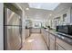 Bright kitchen featuring granite counters, stainless steel appliances, and a view of the outdoor scenery at 513 Mt Blue Sky Rd, Golden, CO 80401