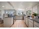 Charming kitchen featuring granite counters, stainless steel appliances, and a window overlooking the scenic outdoors at 513 Mt Blue Sky Rd, Golden, CO 80401