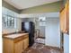 This kitchen features wood cabinets, stone floors, and windows that overlook the forest at 513 Mt Blue Sky Rd, Golden, CO 80401