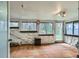 This room features tile flooring, natural light through large windows, and forest views at 513 Mt Blue Sky Rd, Golden, CO 80401