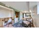 Spacious living room features stone floors, built-in desk, shelving and seating area at 513 Mt Blue Sky Rd, Golden, CO 80401