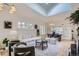Bright and spacious living room with ample seating, skylights, hardwood floors and seamless flow to dining at 513 Mt Blue Sky Rd, Golden, CO 80401