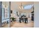 Open-concept living room features hardwood floors, large windows, and a sunlit, airy atmosphere at 513 Mt Blue Sky Rd, Golden, CO 80401