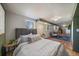 Main bedroom with grey headboard and stone floors at 513 Mt Blue Sky Rd, Golden, CO 80401