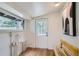 Bright mudroom with wood floors, bench, and access to the outdoors at 513 Mt Blue Sky Rd, Golden, CO 80401