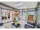 This screened in porch features skylights, wood storage, and outdoor views at 513 Mt Blue Sky Rd, Golden, CO 80401