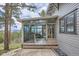 This sunroom has many windows with views of the yard and the mountains beyond, as well as access to a deck at 513 Mt Blue Sky Rd, Golden, CO 80401