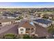 Aerial view showcasing a well-maintained home with solar panels, nestled in a vibrant community at 8505 S Tibet Ct, Aurora, CO 80016