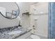 Updated bathroom features modern sink, soaking tub, and crisp white color scheme at 8505 S Tibet Ct, Aurora, CO 80016