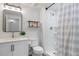 Modern bathroom features new fixtures, walk-in shower, and crisp white color scheme at 8505 S Tibet Ct, Aurora, CO 80016