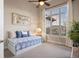Bright bedroom with a daybed, large window and lots of natural light at 8505 S Tibet Ct, Aurora, CO 80016