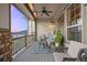 Cozy covered deck equipped with heaters, fan, and comfortable seating, perfect for relaxation at 8505 S Tibet Ct, Aurora, CO 80016