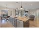 Open kitchen island with granite countertops and modern stainless steel appliances overlooking the living area at 8505 S Tibet Ct, Aurora, CO 80016
