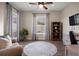 Cozy living room with a patterned rug, a chair, and lots of natural light at 8505 S Tibet Ct, Aurora, CO 80016