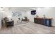 Living room features modern decor, comfortable seating, and entertainment bar at 8505 S Tibet Ct, Aurora, CO 80016