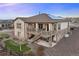 Stunning home with a multi-level deck, stone accents, and solar panels for energy efficiency at 8505 S Tibet Ct, Aurora, CO 80016