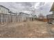 Wide shot of fenced backyard showing natural, low-maintenance landscaping at 19558 E Purdue Pl, Aurora, CO 80013