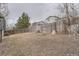 Backyard featuring a wooden fence and natural, low-maintenance landscaping at 19558 E Purdue Pl, Aurora, CO 80013