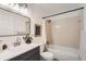 Well-lit bathroom features a modern vanity, shower-tub combination, and sleek fixtures at 19558 E Purdue Pl, Aurora, CO 80013