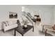 Comfortable living room with carpeted floors and stairs leading to second floor at 19558 E Purdue Pl, Aurora, CO 80013