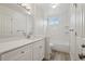 Bathroom features white subway tile in shower and white vanity with modern fixtures at 6337 W 68Th Pl, Arvada, CO 80003