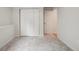 Spacious bedroom with neutral carpet, closet, and door to hallway at 6337 W 68Th Pl, Arvada, CO 80003