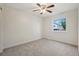 Bright bedroom featuring carpet floors, neutral walls, and a ceiling fan at 6337 W 68Th Pl, Arvada, CO 80003