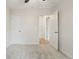Clean bedroom featuring neutral paint, modern baseboards, gray carpet, and an open door to the hallway at 6337 W 68Th Pl, Arvada, CO 80003
