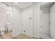 Laundry room with new washer/dryer hookups, leading to the nearby bathroom at 6337 W 68Th Pl, Arvada, CO 80003