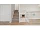Open floor plan with view from upper level to living room with fireplace at 6337 W 68Th Pl, Arvada, CO 80003
