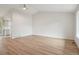 Open living room with vaulted ceilings, hardwood floors and a modern ceiling fan at 6337 W 68Th Pl, Arvada, CO 80003