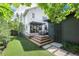 Well manicured backyard with a wooden deck, and covered patio at 2899 Emporia Ct, Denver, CO 80238
