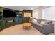 The finished basement features carpeted floors and a comfortable seating area at 2899 Emporia Ct, Denver, CO 80238