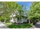 Beautiful home with a inviting front porch and lush landscaping enhancing its curb appeal at 2899 Emporia Ct, Denver, CO 80238
