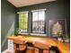 Cozy home office featuring built-in desk and beautiful natural light from the exterior at 2899 Emporia Ct, Denver, CO 80238