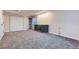 Finished basement with a wet bar, wine fridge, and neutral carpeting providing a cozy entertainment space at 375 Longspur Dr, Brighton, CO 80601
