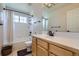 Neutral bathroom featuring tub/shower combo and spacious vanity at 375 Longspur Dr, Brighton, CO 80601