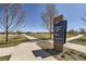Daytime view of the Dewey W. Strong Park sign and walking path at 375 Longspur Dr, Brighton, CO 80601