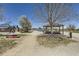 Daytime park view with baseball field, statue and picnic shelter at 375 Longspur Dr, Brighton, CO 80601