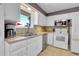 A well-lit kitchen showcasing a stainless steel sink and modern appliances at 960 S Arbutus St, Lakewood, CO 80228
