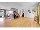 Bright and open living space with hardwood floors flowing into the dining area and kitchen at 960 S Arbutus St, Lakewood, CO 80228