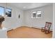 Bright living room with hardwood floors and large windows that provide natural light at 960 S Arbutus St, Lakewood, CO 80228
