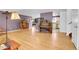 Spacious living room with hardwood floors, a bookcase, a piano, and great natural light at 960 S Arbutus St, Lakewood, CO 80228