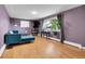 A spacious living room with a large window and hardwood floors at 960 S Arbutus St, Lakewood, CO 80228