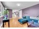 Living room featuring hardwood floors and access to kitchen at 960 S Arbutus St, Lakewood, CO 80228