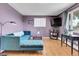 Inviting living room with a comfortable couch and a mounted television at 960 S Arbutus St, Lakewood, CO 80228